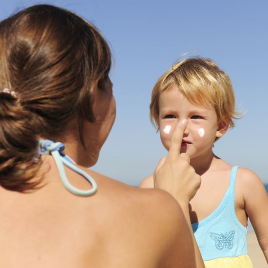 Camp Counselors Applying Sunscreen