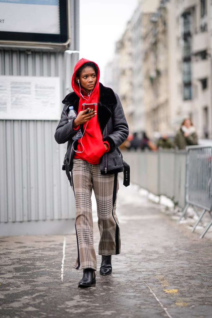 Team Your Black Boots With Checked Trousers and a Red Hoodie