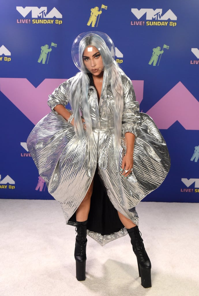 The "Rain On Me" singer wore a clear face shield to match her metallic moon person-inspired dress.