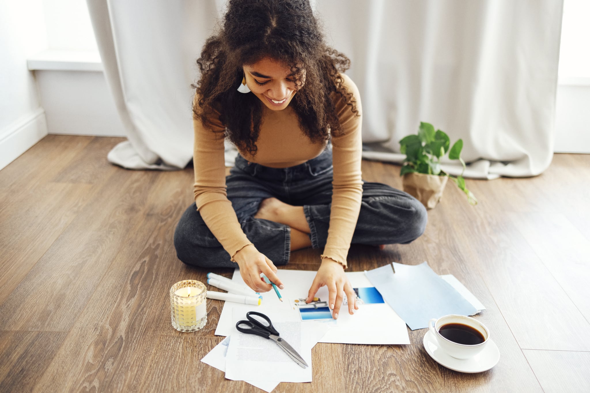 Young woman crafting vision board