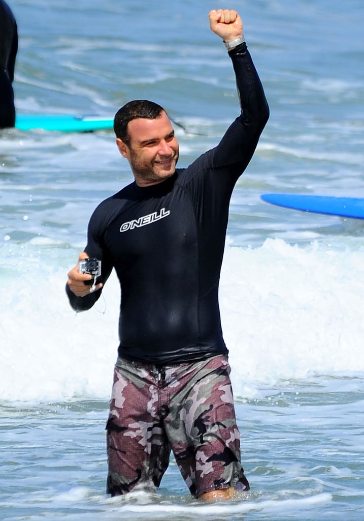 Liev Schreiber got excited while surfing with his family in LA on Sunday.