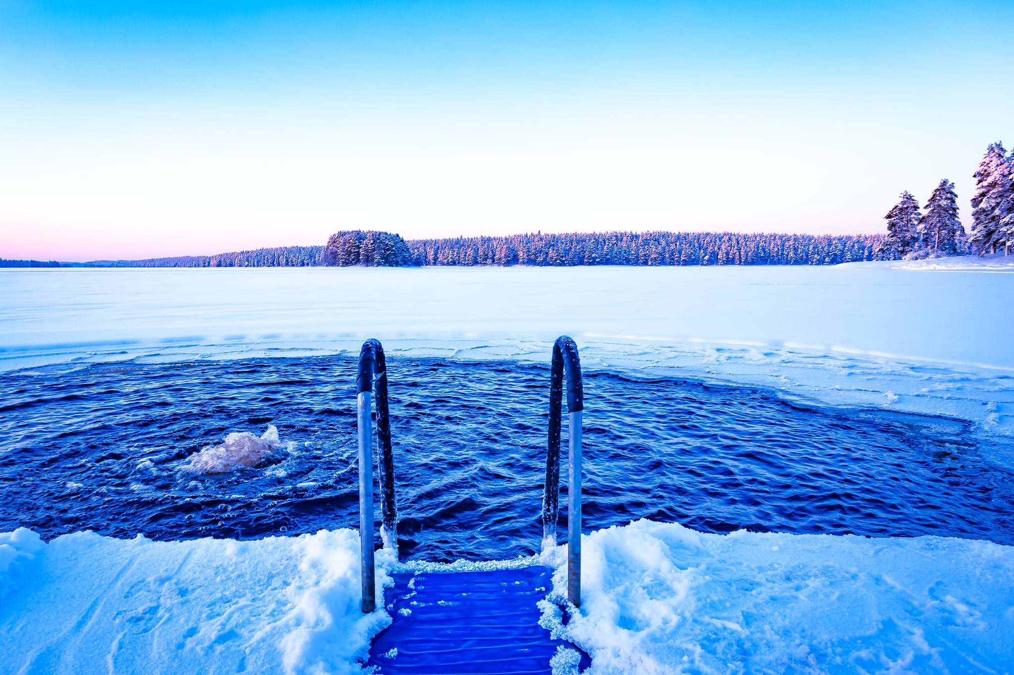 image of a swimming hole in an icy lake to represent benefits of cold plunging