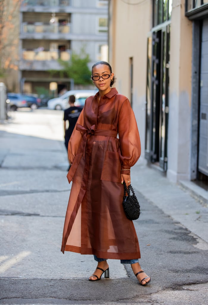 Pair a sheer puff-sleeved trench coat with matching, '90s-inspired sunglasses
