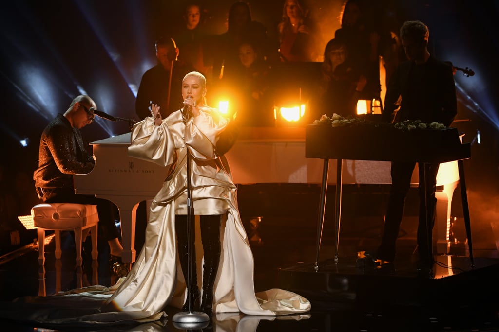 A Great Big World and Christina Aguilera made an iconic return to the American Music Awards on Sunday. After performing their Grammy-winning hit "Say Something" during the award show in 2013, the pop duo and singer returned to the stage to sing their new song "Fall on Me." As Ian Axel played the piano, Aguilera moved us to tears with her incredible vocals. Grab some tissues and watch their heartfelt performance ahead.