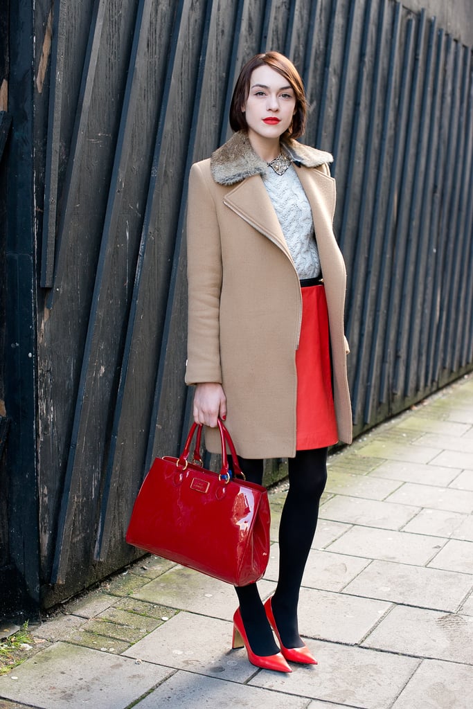 Ella Catliff knows that a little red goes a long way and happens to look gorgeous with a camel-hued coat.