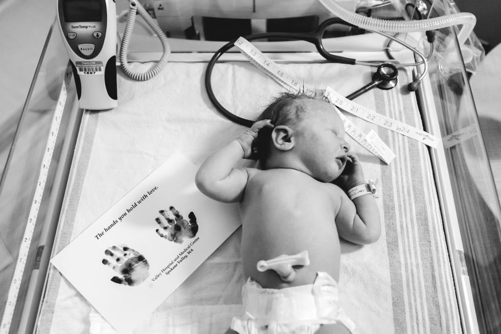Tearful Rainbow Baby Birth Photo