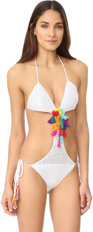 If you want to dip your toe into the rainbow-hued pool, try this Anna Kosturova Pom Pom Monokini ($250).