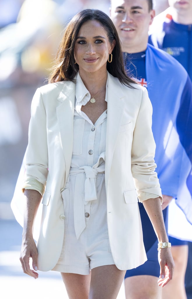 During another day at the Invictus Games earlier this month, Markle wore an belted ivory playsuit with an oversize cream blazer.
