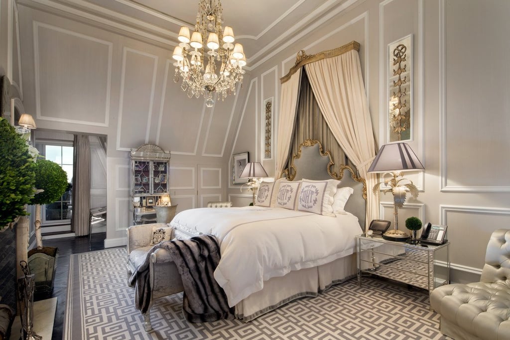 The dramatic canopy is indicative of the collection of antiques scattered throughout the penthouse.
