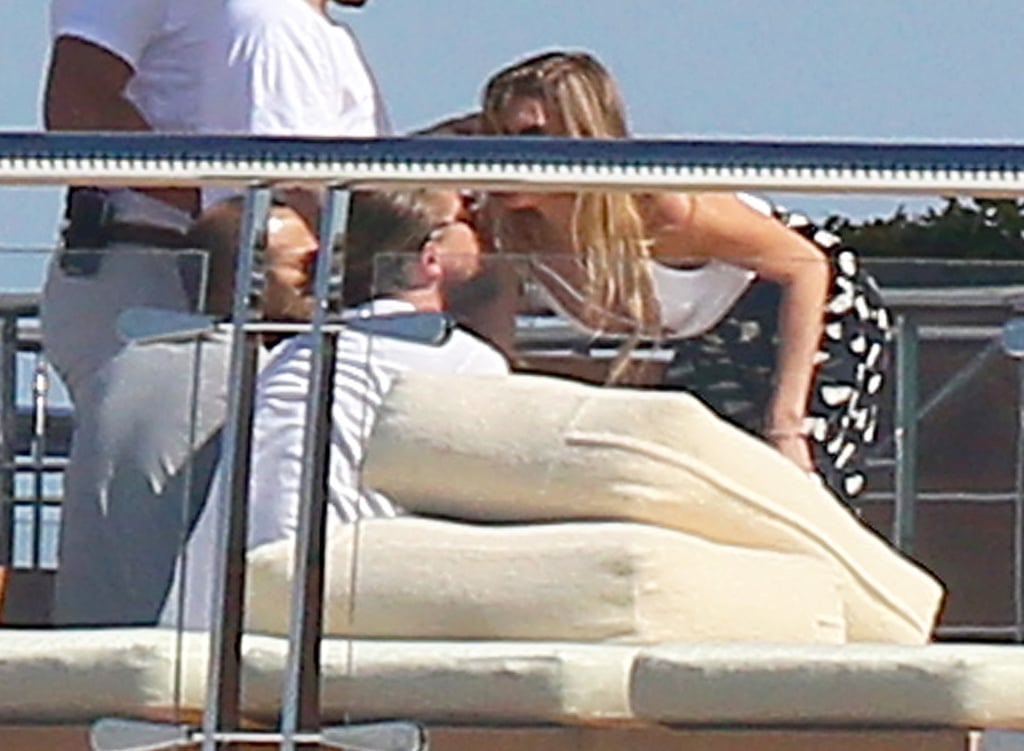 Leo greeted a female friend who hopped on the yacht on Tuesday.