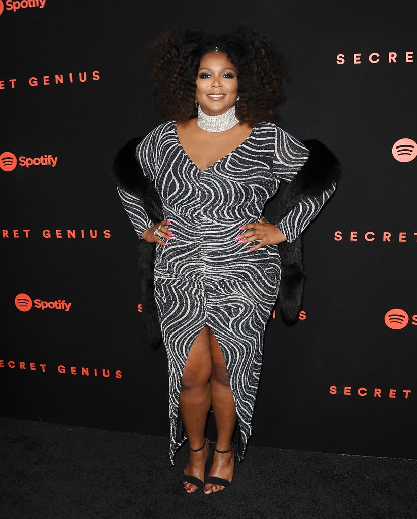 One of our favourite Lizzo looks is this front-slit zebra-print cocktail dress, which she paired with an glimmery high-collar necklace and a black faux fur shrug. While it's one of her classiest looks to date, Lizzo made the look her own with lots of bling and a gorgeous pink manicure.