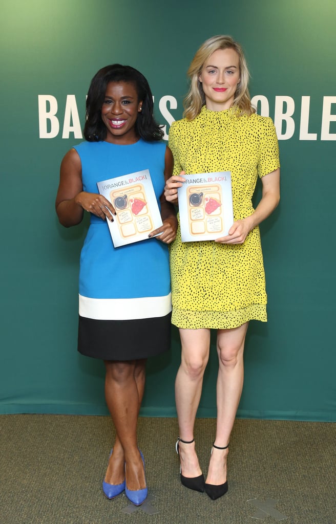 Uzo Aduba and Taylor Schilling joined forces to promote the Orange Is the New Black Presents: The Cookbook at Barnes & Noble in NYC on Friday.
