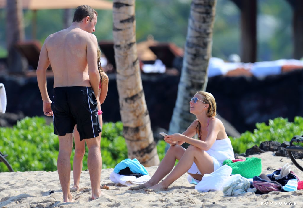 Gwyneth and Chris talked on the beach.