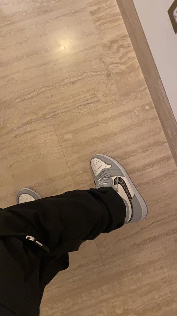 Travis Scott in a Pair of Dior x Nike Jordan 1s