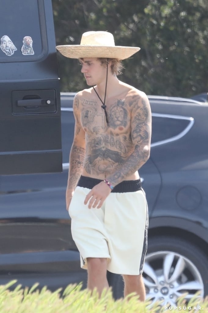 Justin Bieber has been focusing on his fitness ever since he split from Selena Gomez, and on Sunday, he went for a hike with his friends in Malibu, CA. In true Justin fashion, the 24-year-old singer ditched his shirt and put his tattoos on display — all of which took more than 100 hours, by the way. At one point, Justin even took off one of his shoes and walked with just his sock on — maybe he felt a blister coming on? 
Justin and Selena recently decided to put a pause on their relationship, but it seems like their break has now turned into a full-on breakup. While nothing has been officially confirmed yet, according to E! News, "Selena realized even though he's made some positive improvements, they just aren't a perfect match right now." Justin was also spotted getting handsy with model Baskin Champion at an LA nightclub last month, though sources say they aren't dating. 

    Related:

            
            
                                    
                            

            We&apos;re Almost Certain No One Has Gone Shirtless as Many Times as Justin Bieber
