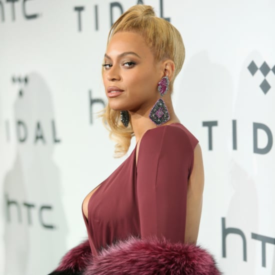 Beyonce's Assistant Adjusting Her Dress at the Tidal Concert