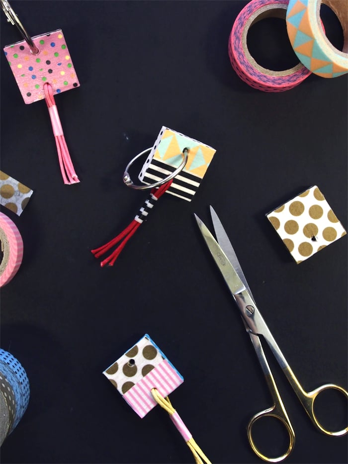 First up, you'll need:

All your favorite washi tapes
Colorful cord
Balsa wood (which we'll cut into 5 x 5cm pieces)
Craft knife
Scissors
Clear varnish or gel medium
A drill or dremel
A large split ring or binder ring

Start by cutting your balsa to size with a craft knife. Balsa wood is super soft so this shouldn't be too tricky. I made my pieces 5x5cm as this fits two widths of washi side-by-side. Once you've got your piece, use a dremel or drill to make holes for the ring and a tassel (optional!).