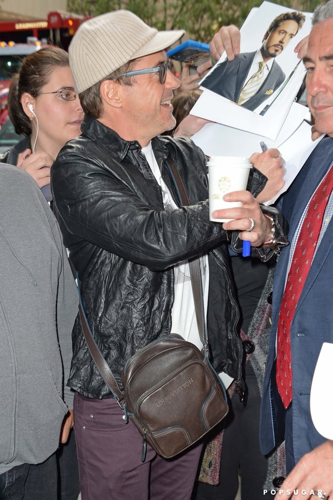 On Tuesday, Robert Downey Jr. signed autographs with a smile when he arrived at the Ed Sullivan Theater to make an appearance on the Late Show With David Letterman in NYC.