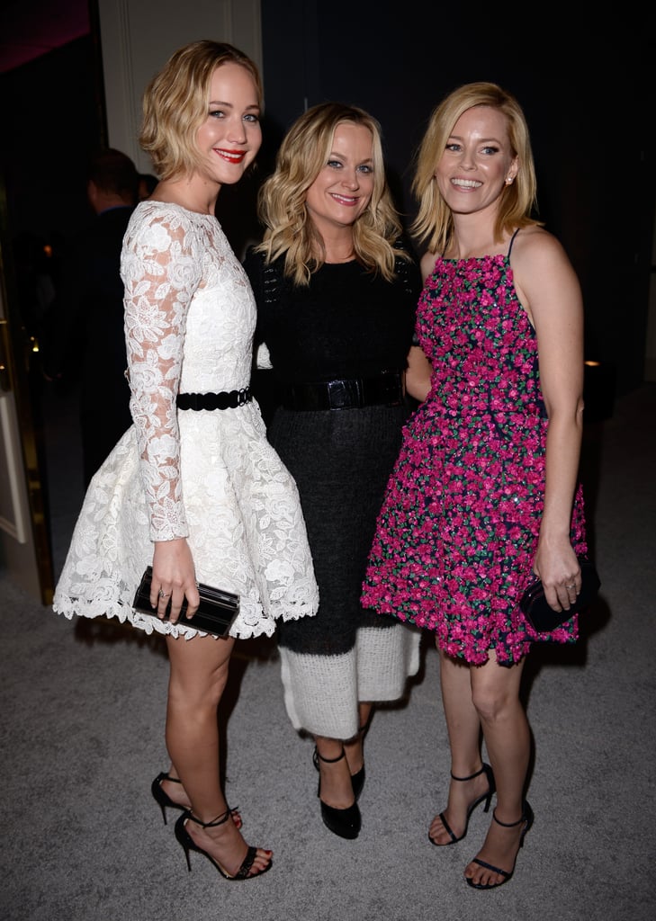 Jennifer Lawrence wore Oscar de la Renta to mingle with Amy Poehler and Elizabeth Banks.