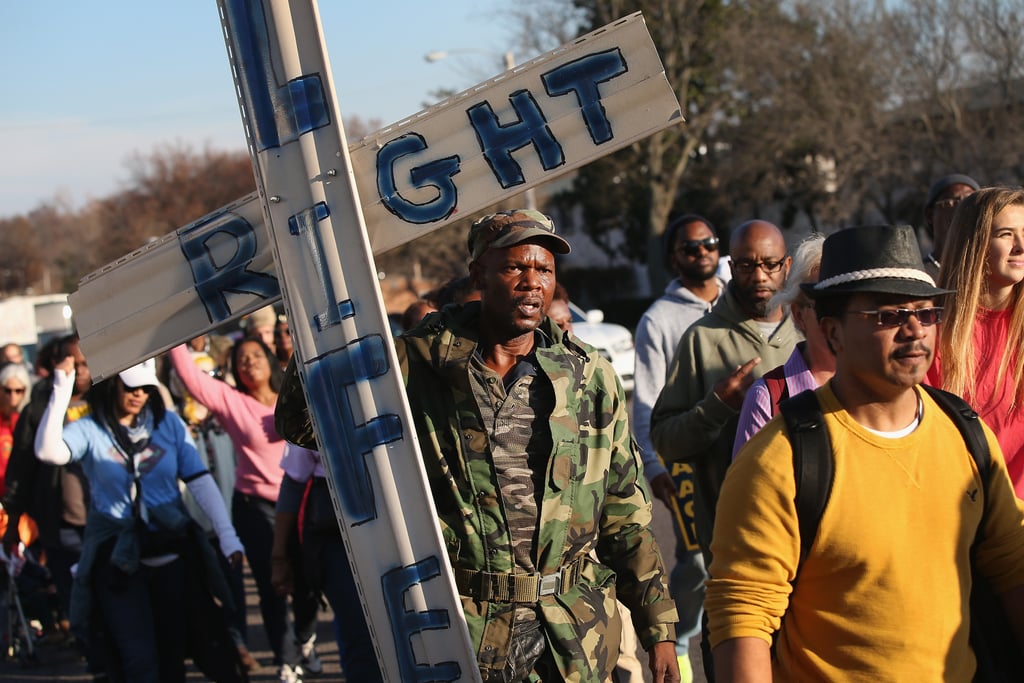 Protesters held signs during their 120-mile march.