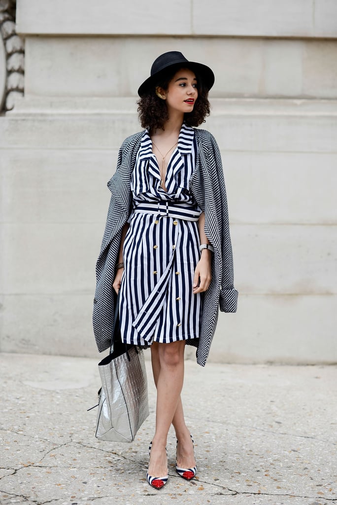 Stripes are always in style, but adding a hat and a casual jacket over your shoulders adds just the right chic European touch.