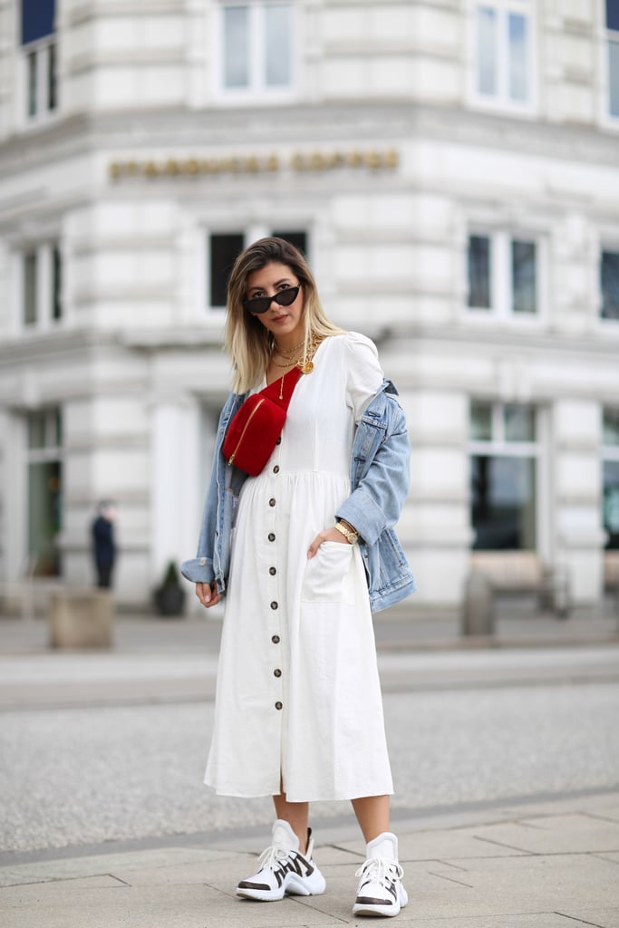 A White Button-Down Dress With a Denim Jacket and Red Fanny Pack
