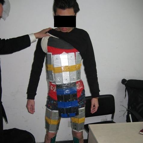 Man With iPhones Strapped to His Body