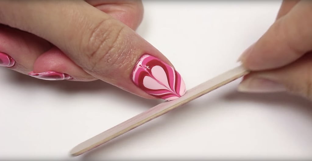 You can use a cuticle pusher to ensure your design is on tight.
In addition to the pusher, you can use 100 percent acetone to clean the excess polish around the nail.
Also, file the top of your nails to clean up the extra polish around the tip.