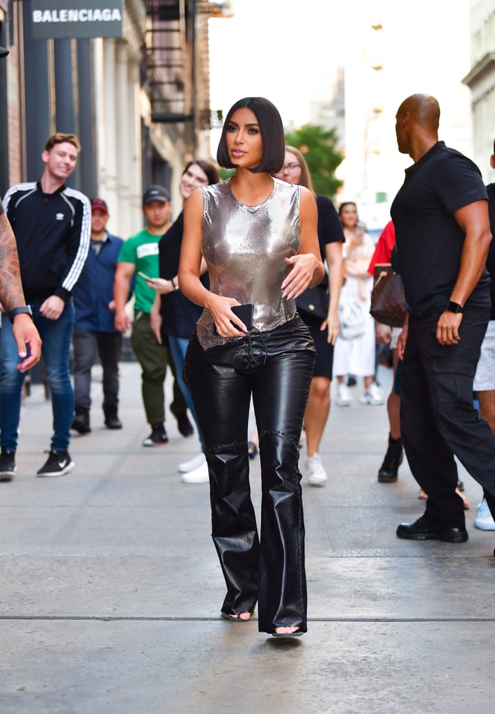 Kim first debuted these while leaving the Balenciaga store in Soho on September 10, 2019. This time, she styled her slacks with a shimmery chainmail tank.