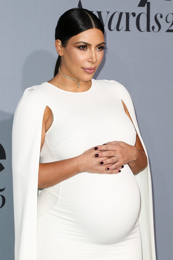 Kim showed off her thin diamond ring, which played up her sparkling choker.