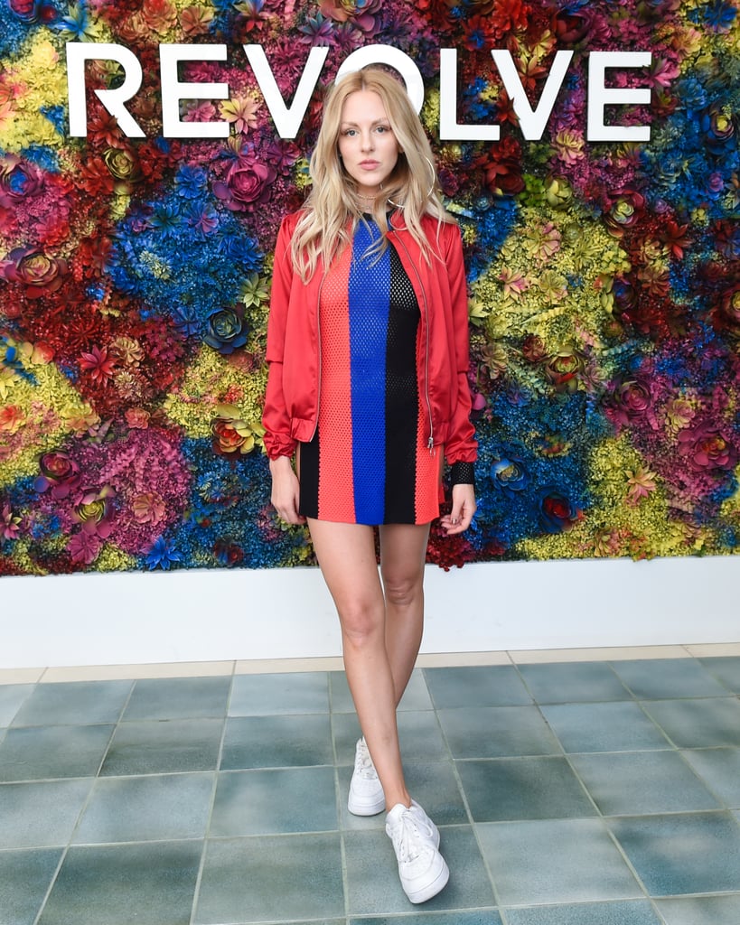 Shea Marie wearing a striped dress and bomber jacket at the Revolve festival.
Shea Marie wearing a striped dress and bomber jacket at the Revolve festival.