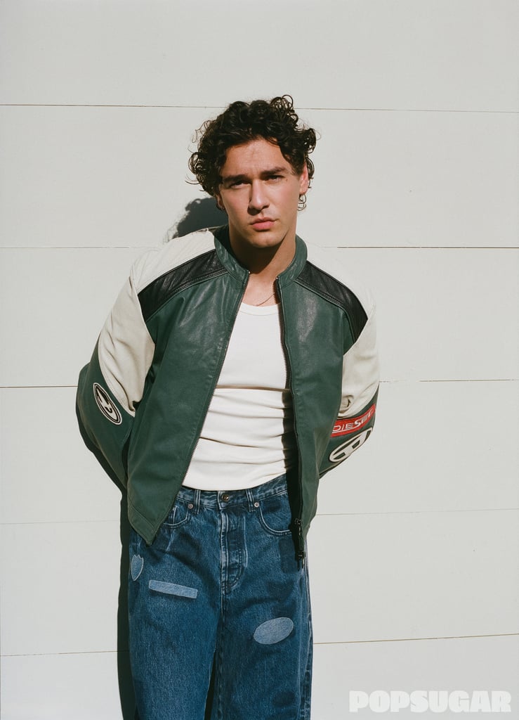 COS Indented Signet ring ($39)
Bright described Cameli's character, Garrett, as "Mr. I Don't Do Girlfriends," and if there was a fashion item that embodies that title, this jacket would be it. The '90s-inspired leather logo topper is such a statement that you can keep the rest of the look simple with a tank and denim.   
Get The Look: Diesel Leather Jacket With Patch Details ($630, originally $1,050). Diesel Relaxed Jeans Regular Waist 1980 De-Eeper ($177, originally $295). Billionaire Boys Club Mercer Motorcycle Jacket ($385). Hanes Mens Essentials Tank Top 3-Pack ($20). H&M Loose Jeans ($45). ASOS Design Molten Asymmetric ring ($13).