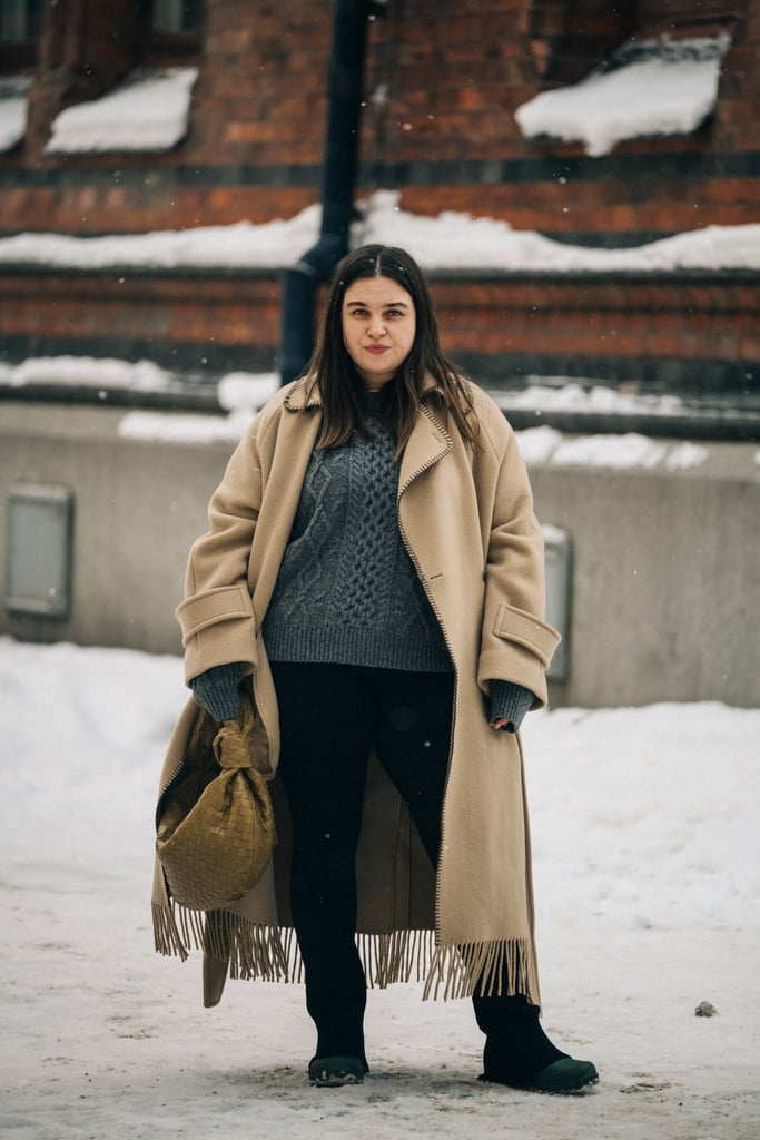 Wear a cable-knit sweater with a long felt coat to amp up the wintry vibes.