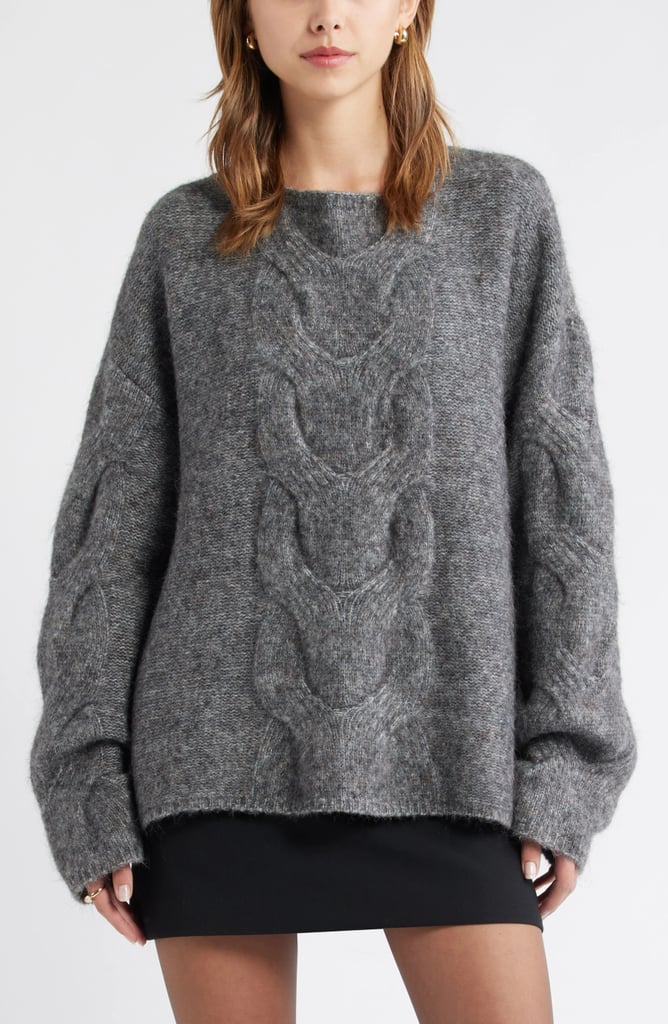 Open Edit Cable Boatneck Sweater ($67, originally $90)
Between the oversized cables, slouchy sleeves, and fuzzy texture, this sweater is equal parts stylish and cozy. Throw it on over a skirt or tuck the front into a pair of jeans for an instant vibe.