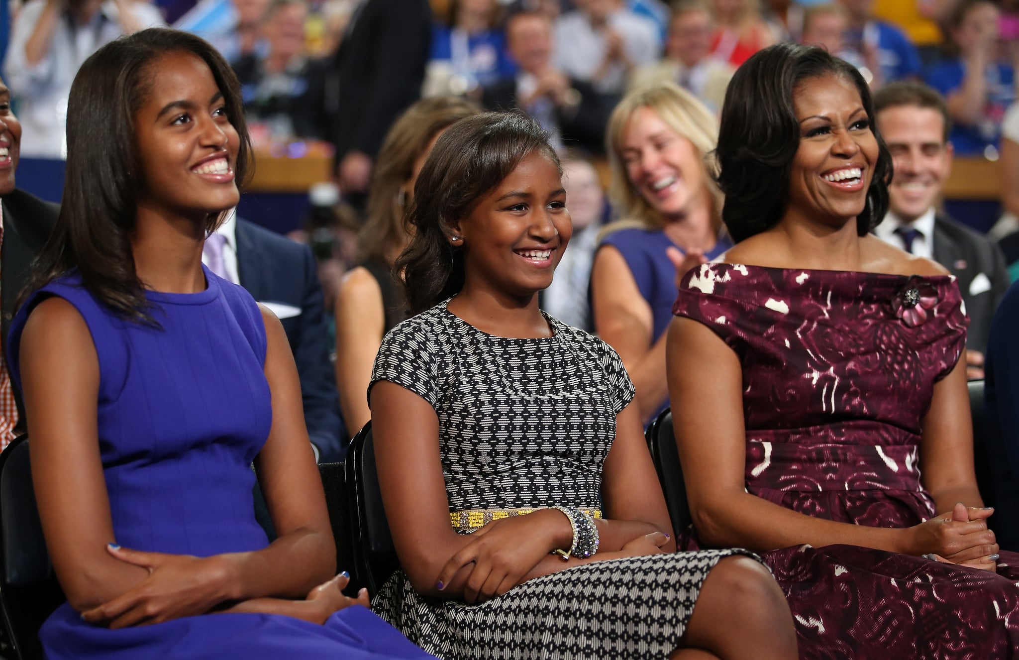 CHARLOTTE, NC - SEPTEMBER 06:  (L-R) Malia Obama, Sasha Obama, and First lady Michelle Obama listen as Democratic presidential candidate, U.S. President Barack Obama speaks on stage during the final day of the Democratic National Convention at Time Warner Cable Arena on September 6, 2012 in Charlotte, North Carolina. The DNC, which concludes today, nominated U.S. President Barack Obama as the Democratic presidential candidate.  (Photo by Chip Somodevilla/Getty Images)