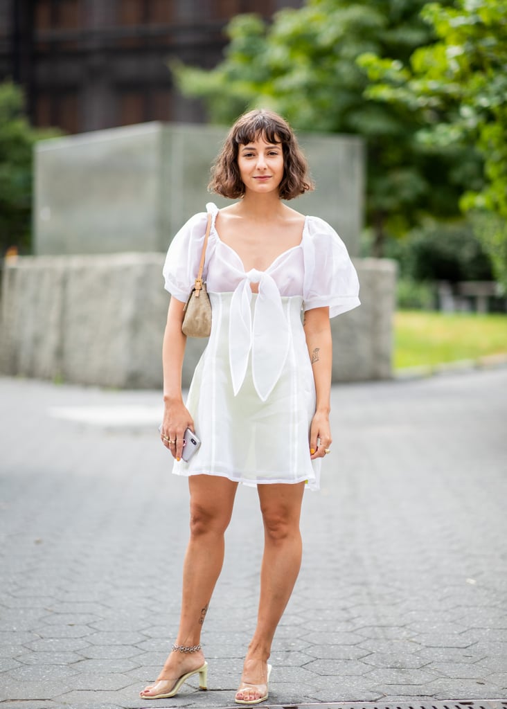 Going braless in a white tie-front dress.