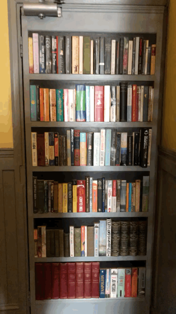 I have to admit, I was a total sucker for the faux-bookcase entrance!