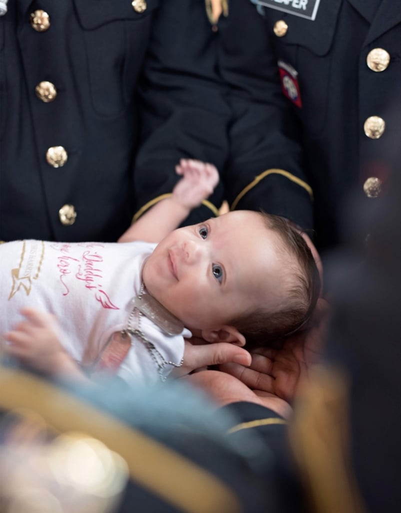 Daughter of Fallen Soldier Photographed With Army Members