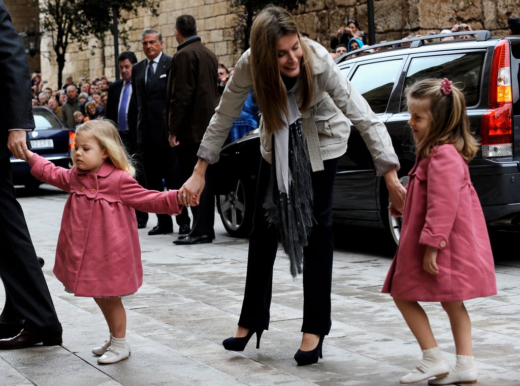 In 2010, Letizia held her young daughter's hands on their way into a church service.