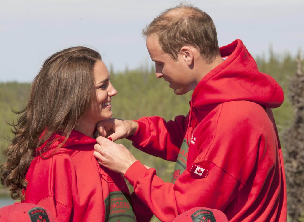 William helped Kate adjust her sweatshirt as the two embarked on a Canadian camping trip in July 2011.