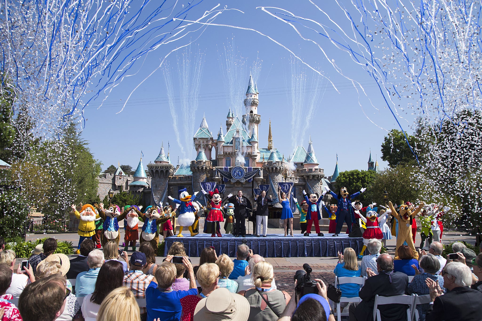 ANAHEIM, CA - JULY 17:  In this handout photo provided by Disney parks, Mickey Mouse and his friends celebrate the 60th anniversary of Disneyland park during a ceremony at Sleeping Beauty Castle featuring Academy Award-winning composer, Richard Sherman and Broadway actress and singer Ashley Brown July 17, 2015 in Anaheim, California.  Celebrating six decades of magic, the Disneyland Resort Diamond Celebration features three new nighttime spectaculars that immerse guests in the worlds of Disney stories like never before with 