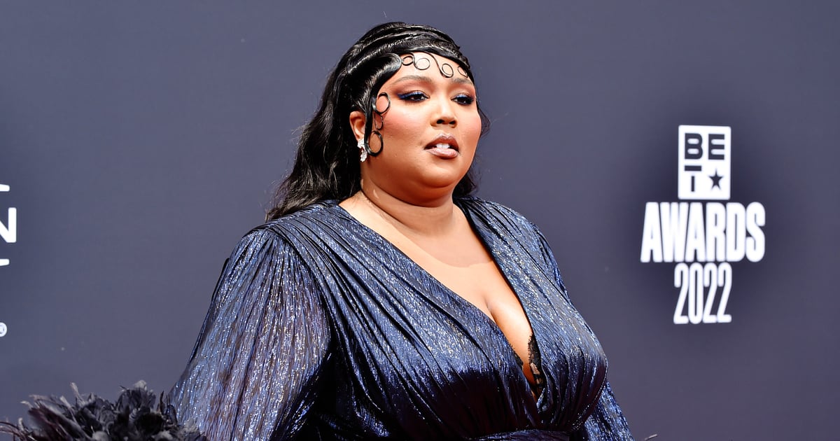 Lizzo Shows Off Her Feathered Sleeves and Thigh-High Slit at the BET Awards.jpg
