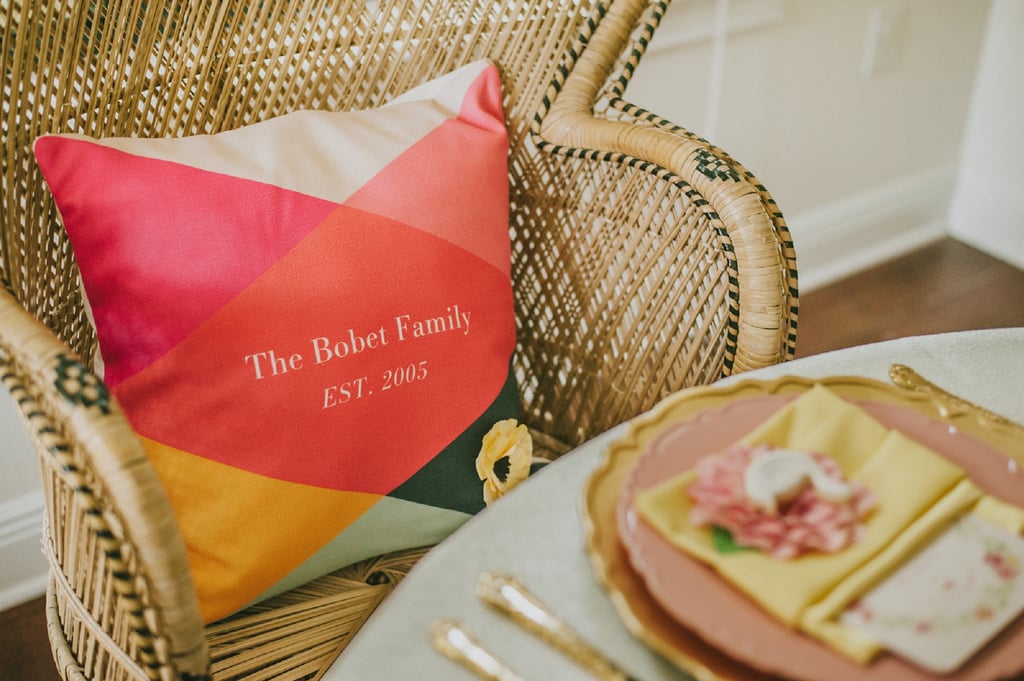 A family pillow created at Tiny Prints was used to designate the mom-to-be's seat.