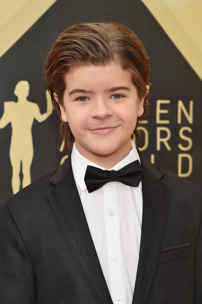 Gaten Matarazzo switched up his signature look at the 2018 SAG Awards. The Stranger Things star straightened his curls when he walked the red carpet, all the while stealing our hearts in his black tuxedo and bow tie. Gaten and the rest of his cast mates are nominated for outstanding performance by an ensemble in a drama series, and our bet is they're taking home the trophy. Keep reading to see more photos of Gaten's new look that will surely have fans doing a double take.
