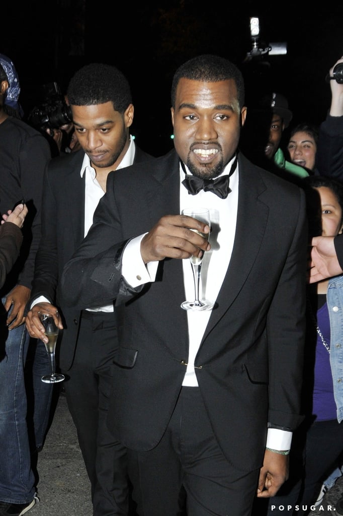Kanye West and Kid Cudi sipped Champagne at the Met Gala afterparty in May 2011.