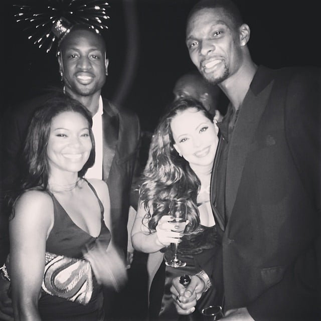 Dwyane Wade reflected on his 2013 in the caption for his New Year's Eve photo with fiancée Gabrielle Union and friends, saying, "2013 was filled with ups and downs," without which a person can't grow.
Source: Instagram user dwyanewade