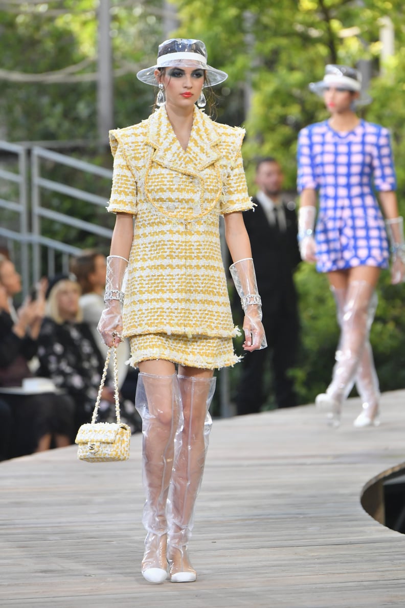 Paul and Joe Ready to Wear Spring Summer American model Chanel Iman wearing  single shoulder short yellow drape dress, black Stock Photo - Alamy