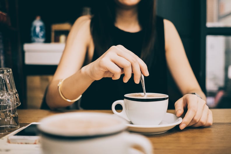 Woman enjoying coffee relaxingly in a cafe