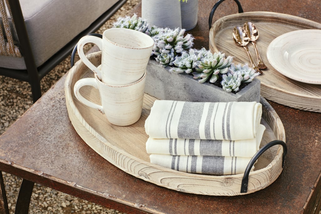 Julianne mixes natural elements, like wood trays and succulent centerpieces, with more elegant servingware like bronze flatware. Julianne explains, "while I love earthy tones and natural fibers, I also like to add metallic elements, especially in brass tones to add a sophisticated element."