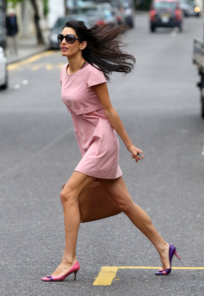 A mad dash across the street looked as graceful as ever in a pastel shift dress and quirky heels.